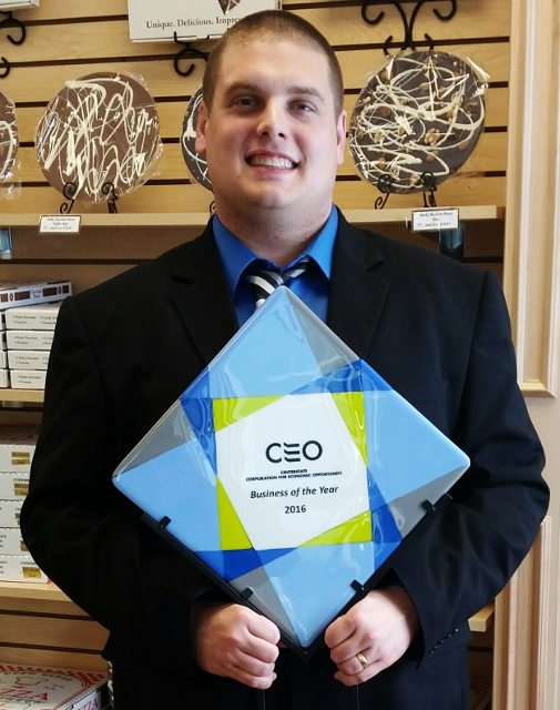 Owner, Ryan Novak, holds "Business of the Year&