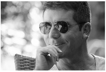 Simon Cowell improves home security after burglary last Dece'