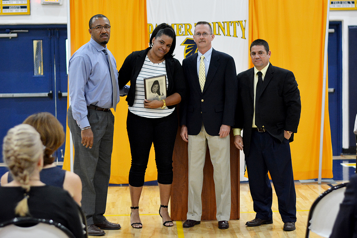 Ernest Robertson, Jr., director of athletics; Arasay Guerra;