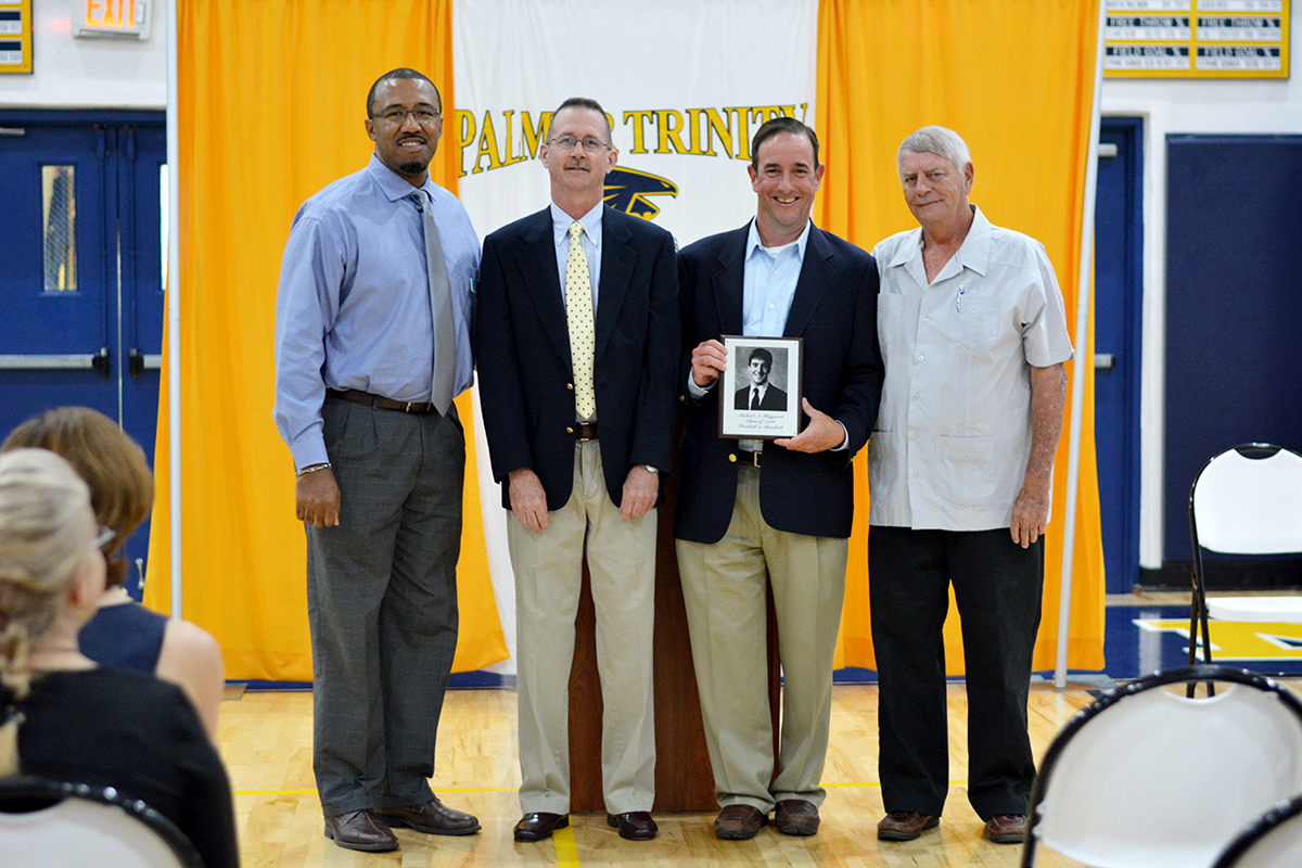 Ernest Robertson, Jr., director of athletics; Tom Magenheime