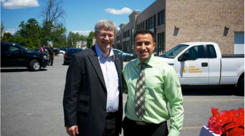 Prime Minister Stephen Harper alongside Chief Relationship B'