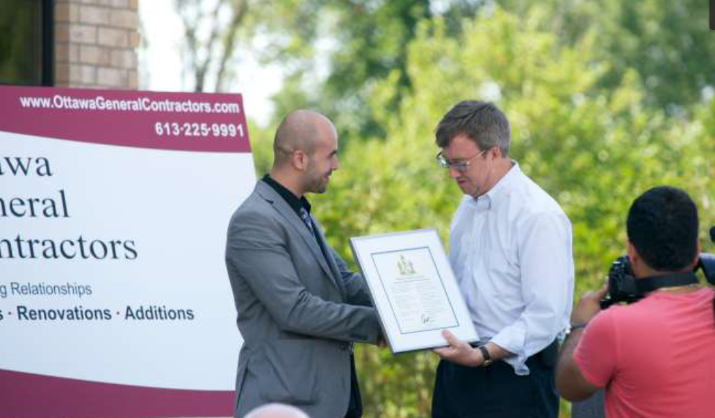 Moe Abbas (OGC) accepting an award from the Mayor of Ottawa'