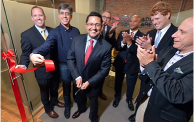 Simon Taylor, President of Comtrade Software, Cuts Ribbon