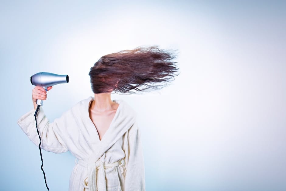 Woman blowing Hair'
