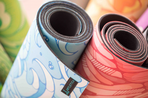 Artletica yoga mats rolled up for the next class.'