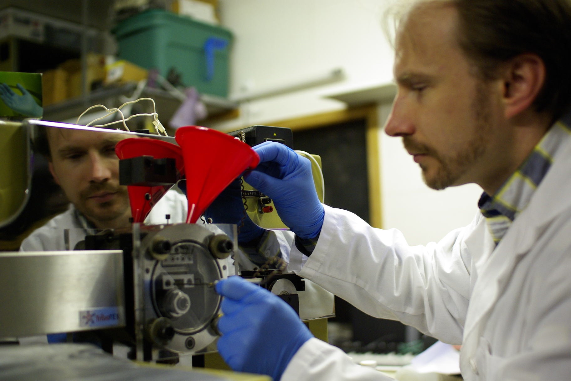 Dr. Rudenko is setting up friction testing in Block-On-Ring'