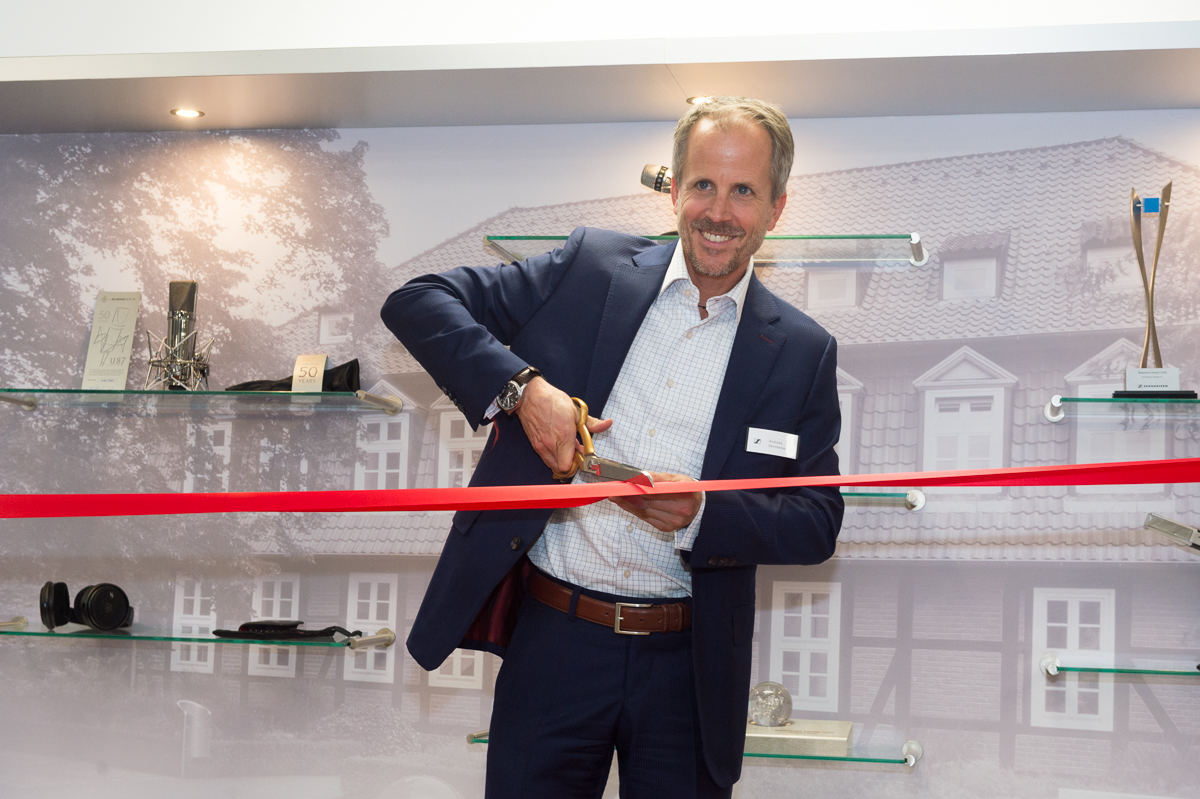 Dr. Andreas Sennheiser, cutting ribbon for Sennheiser