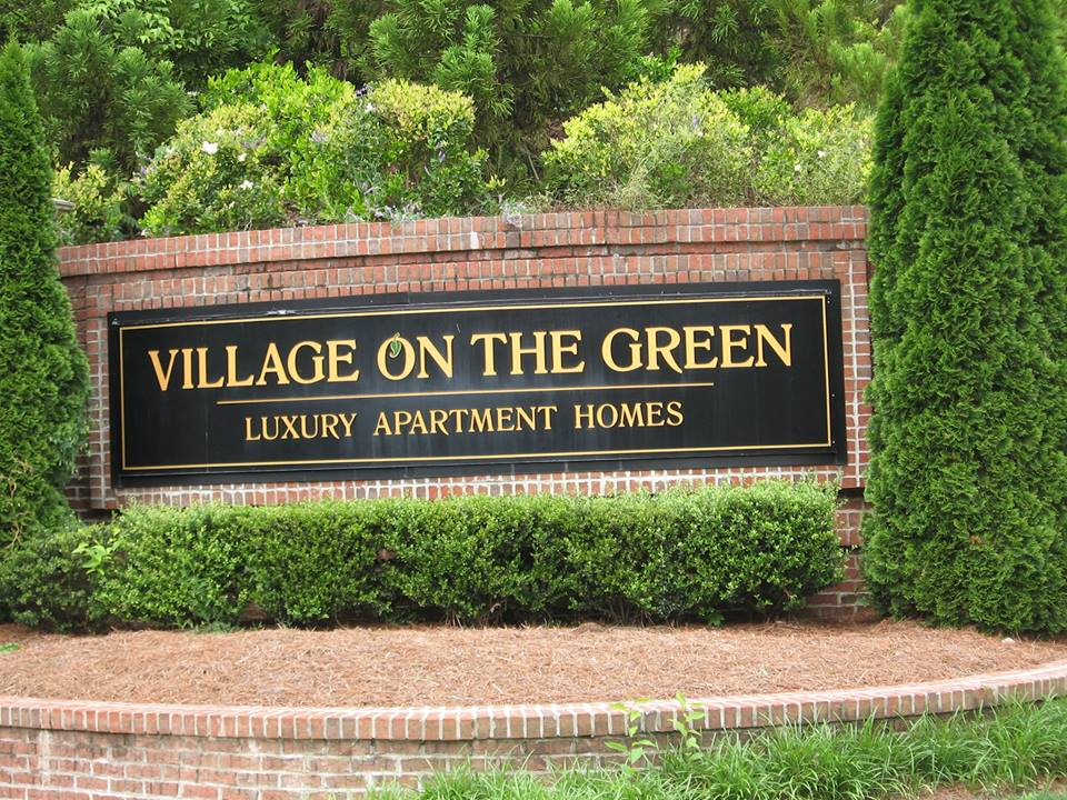 Village On The Green Logo