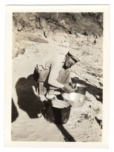 In this photograph, boatman Owen Clark cooks dinner for the'