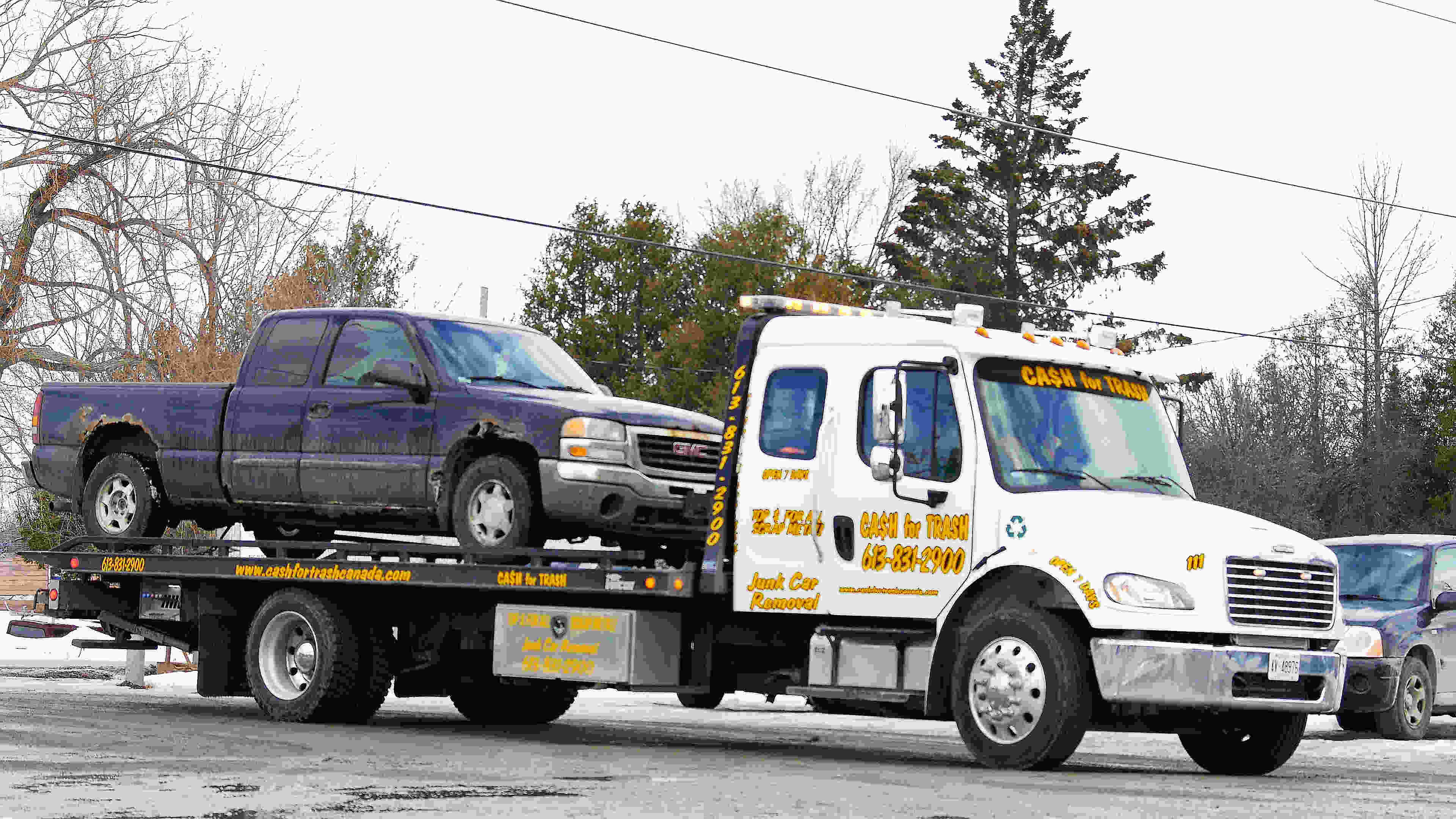 Truck getting towed away for recycling in Ottawa'