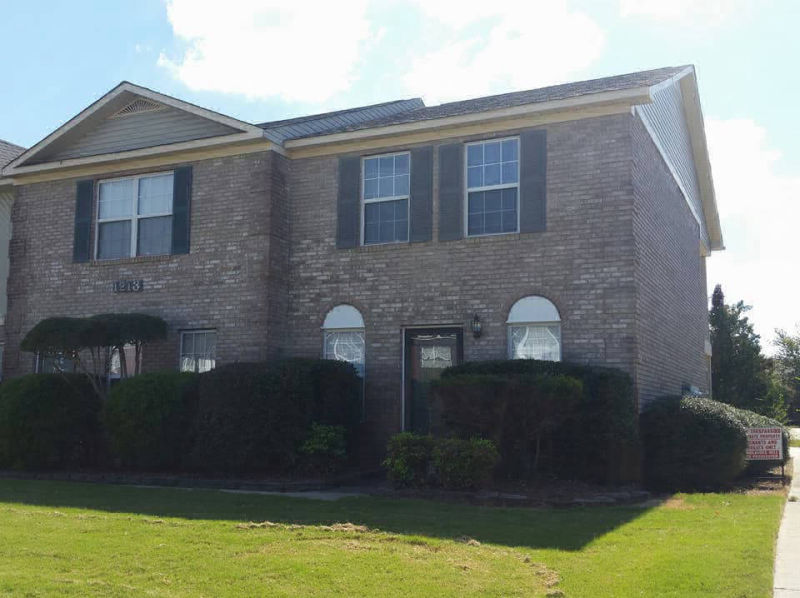 Company Logo For Huntington Place Townhomes'