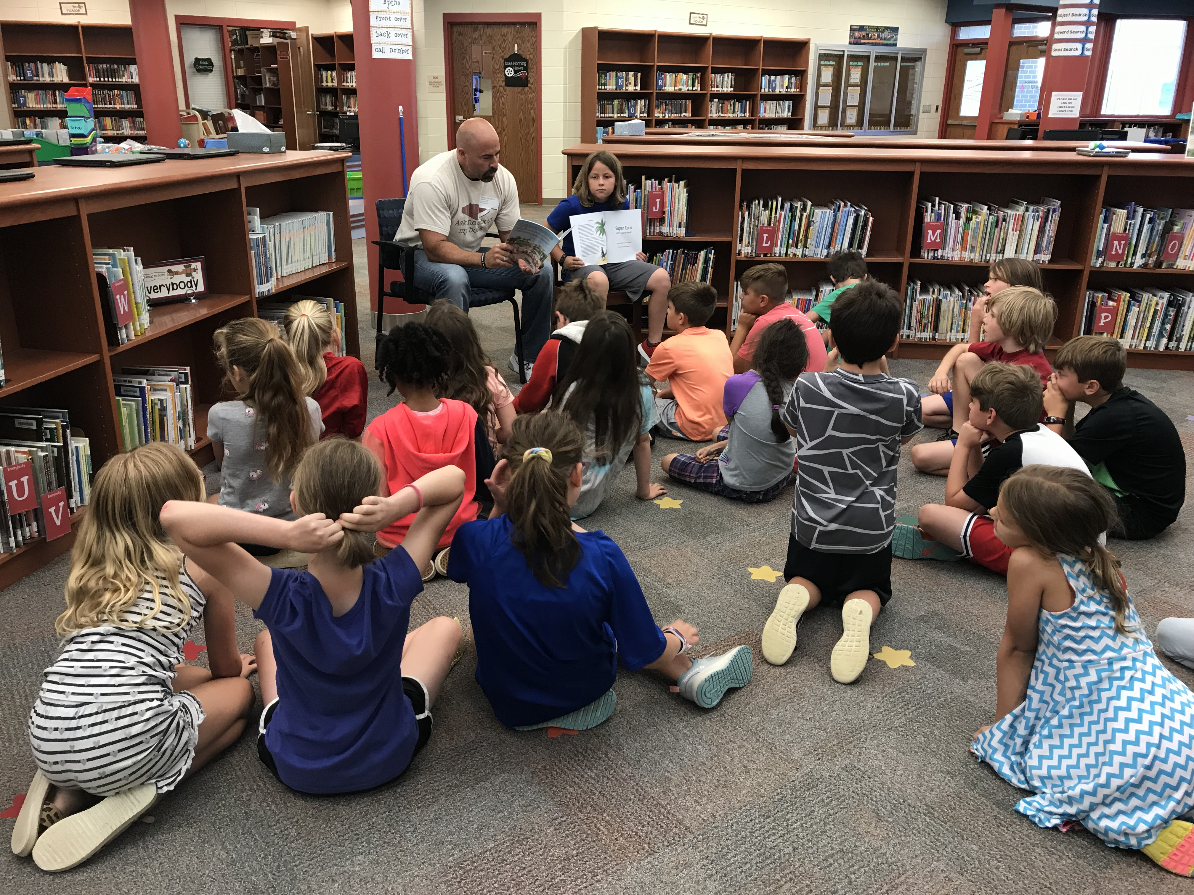 The author reading Super Coco Will You Be My Friend?