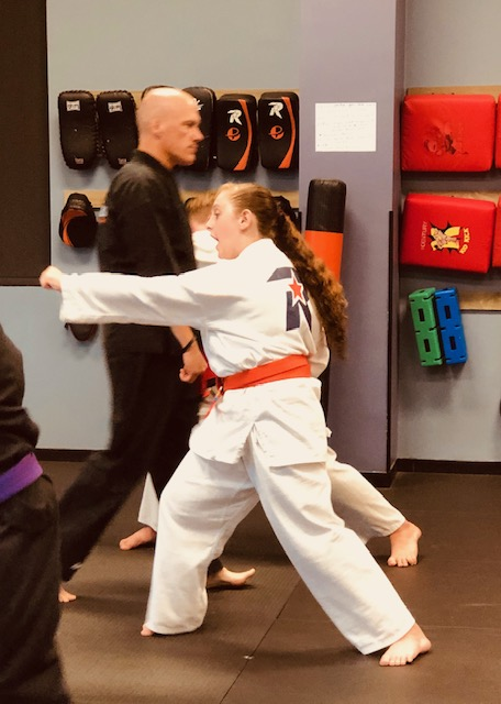 Teen Student practicing focus and punching.
