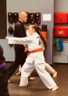 Teen Student practicing focus and punching.'