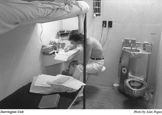 Prisoner writing letter back to pen pal