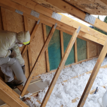 Home attic insulation by First American Roofing'