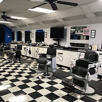 Company Logo For Junis Barber Shop'