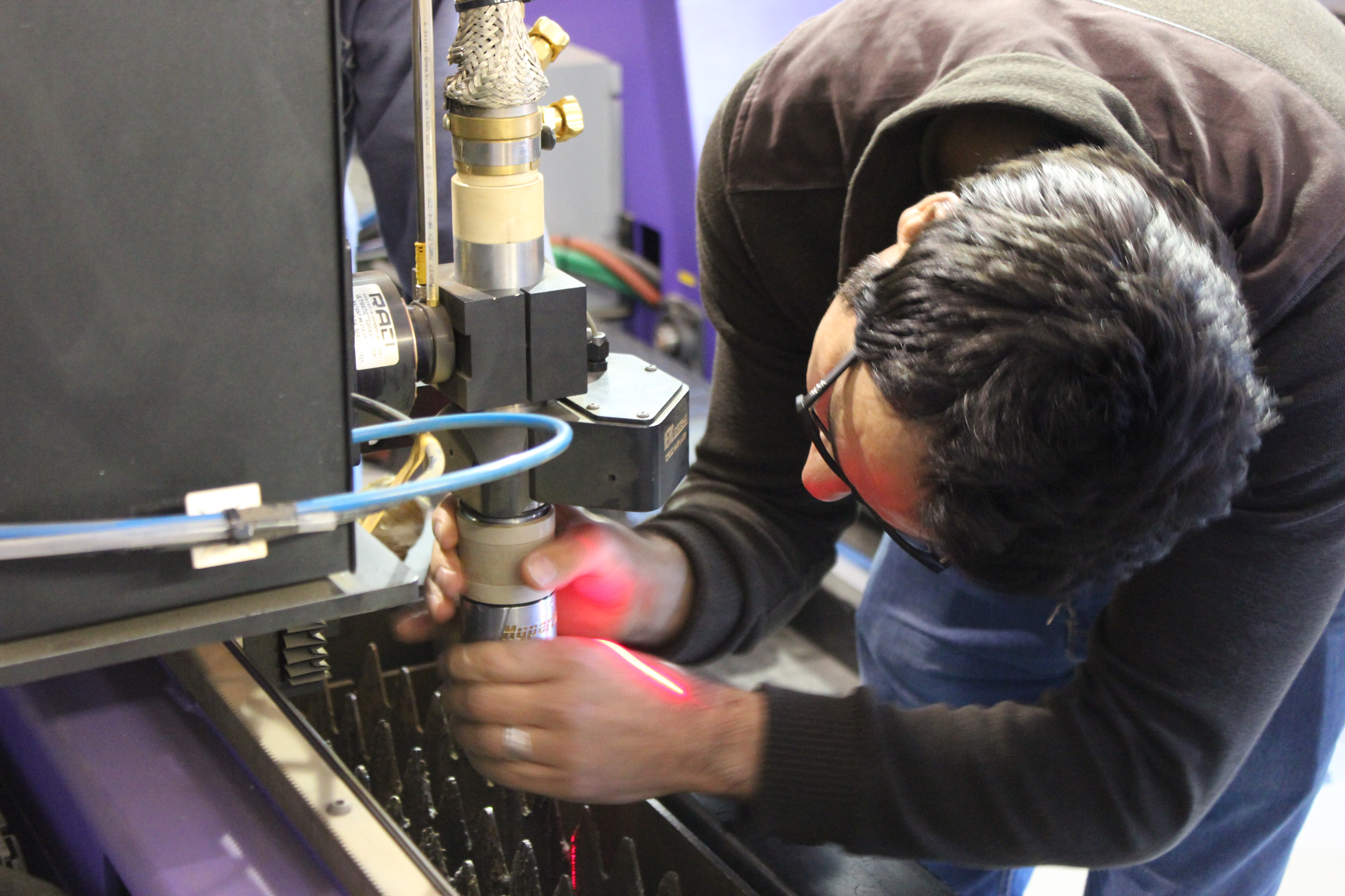 Luai Odeh Servicing Machine'