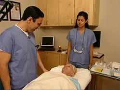 Dr. Simon Ourian examines a patient for hair loss'