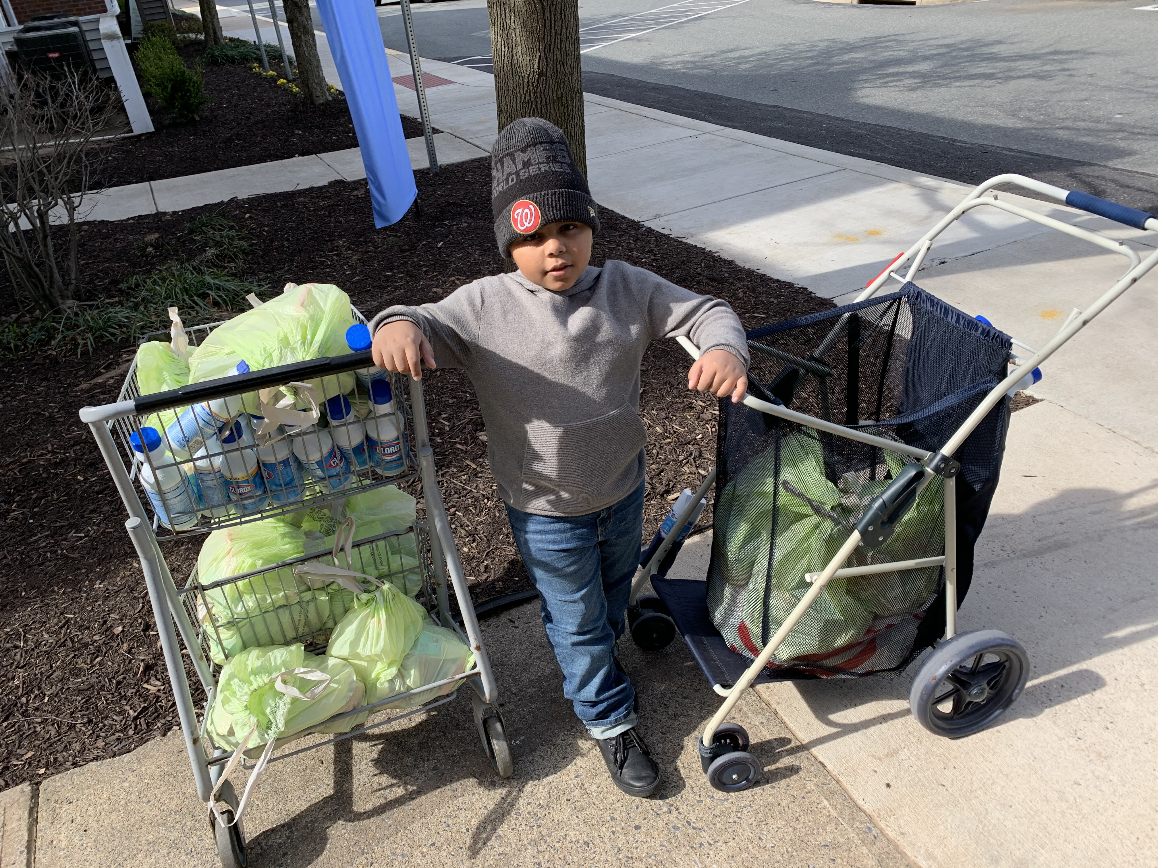 Cavanaugh Bell, 7, distributes carepacks.'