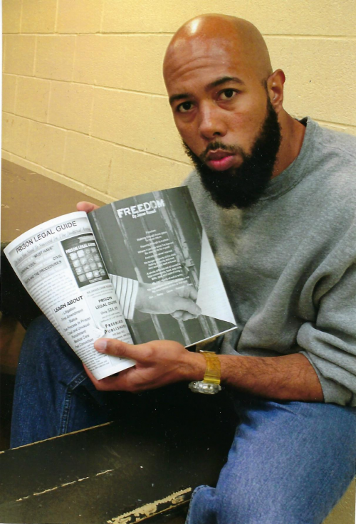 Inmate reading book by Freebird Publishers'