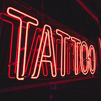 Company Logo For Pain Or Pleasure Tattoo Studio'