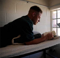Inmate reading book 1