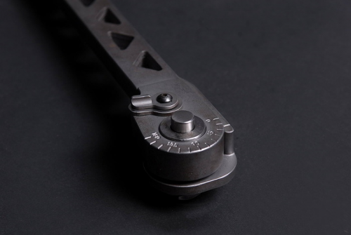 A closeup of the release button on the new Cole-Bar Hammer'