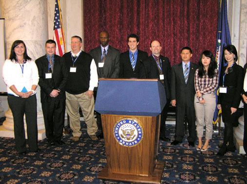 Student presenters pose at the podium at the 2011 Convention