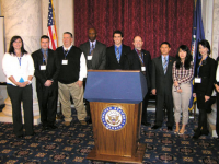 Student presenters pose at the podium at the 2011 Convention