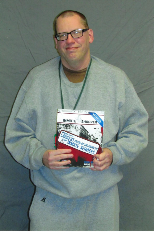 inmate showing his copy of INSH'