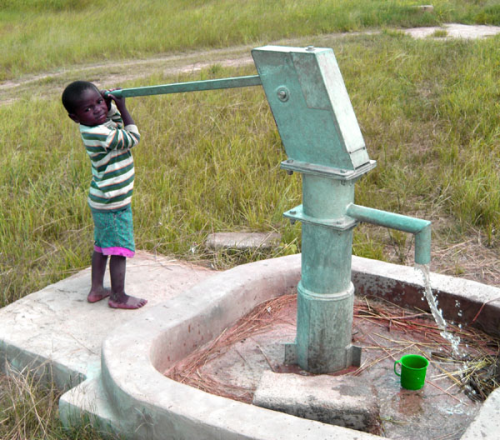 Boy Pumping Water in Solwezi, Zambia'