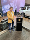 Gary Barbera pictured with JD Power Award and Grand Wagoneer'