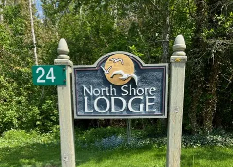 Company Logo For North Shore Beach Lodge'