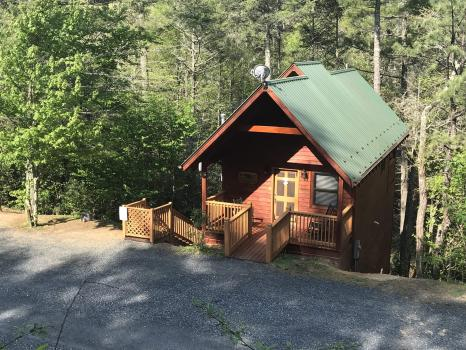 Company Logo For Spacious Skies Campgrounds - Bear Den'