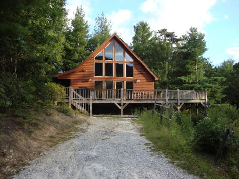 Company Logo For Spacious Skies Campgrounds - Bear Den'