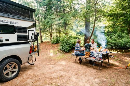 Company Logo For Spacious Skies Campgrounds - Adirondack Pea'