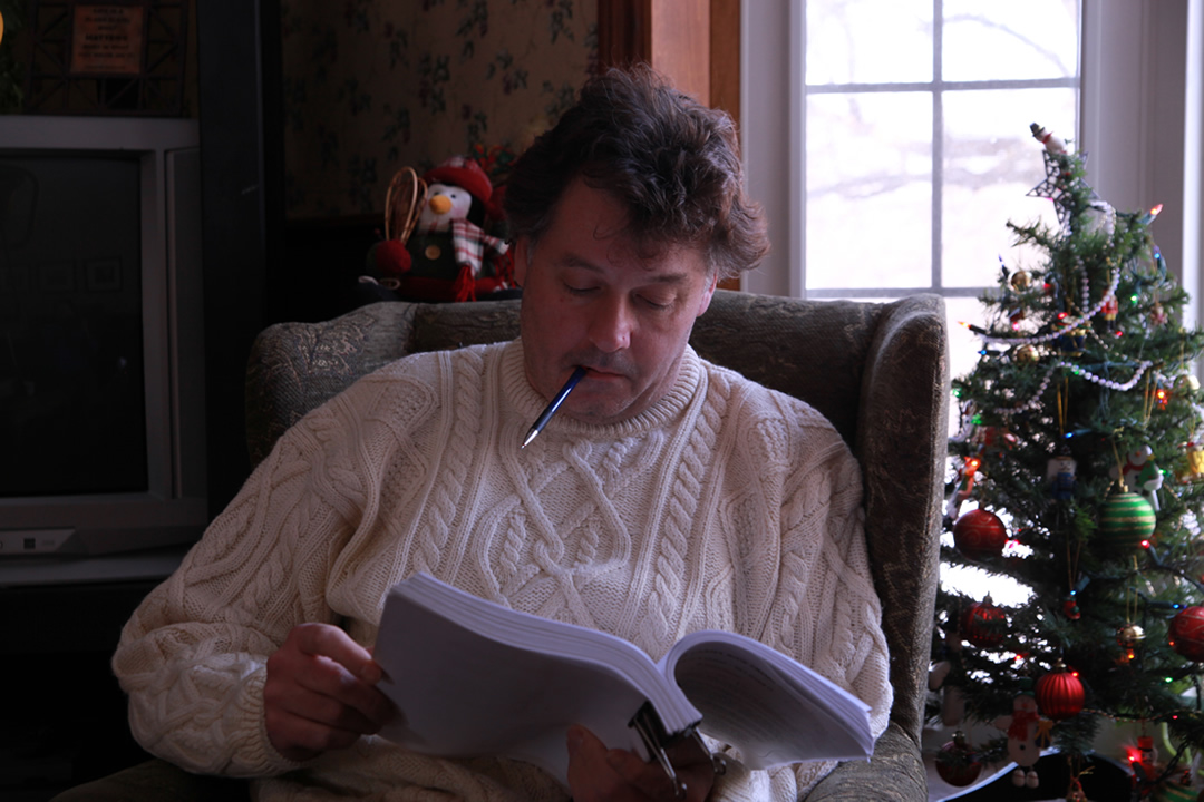 Author, Donat Plenter correcting his manuscript.'