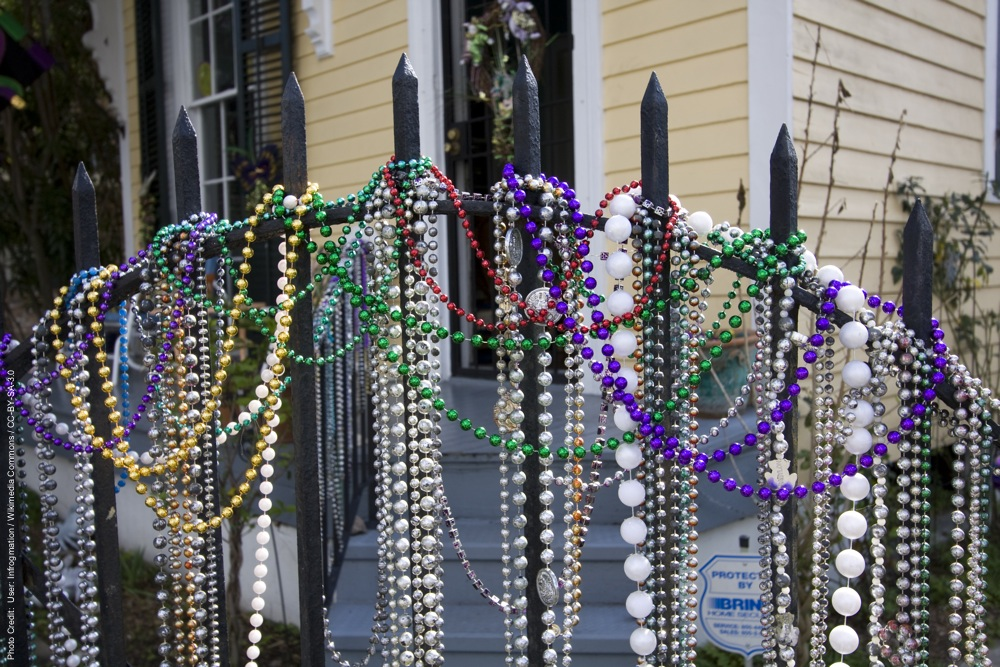 Mardi Gras beads on an iron gate in New Orleans. 2011.