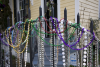 Mardi Gras beads on an iron gate in New Orleans. 2011.'