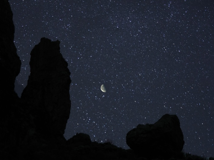 Moon set against a starry sky above Parashant
