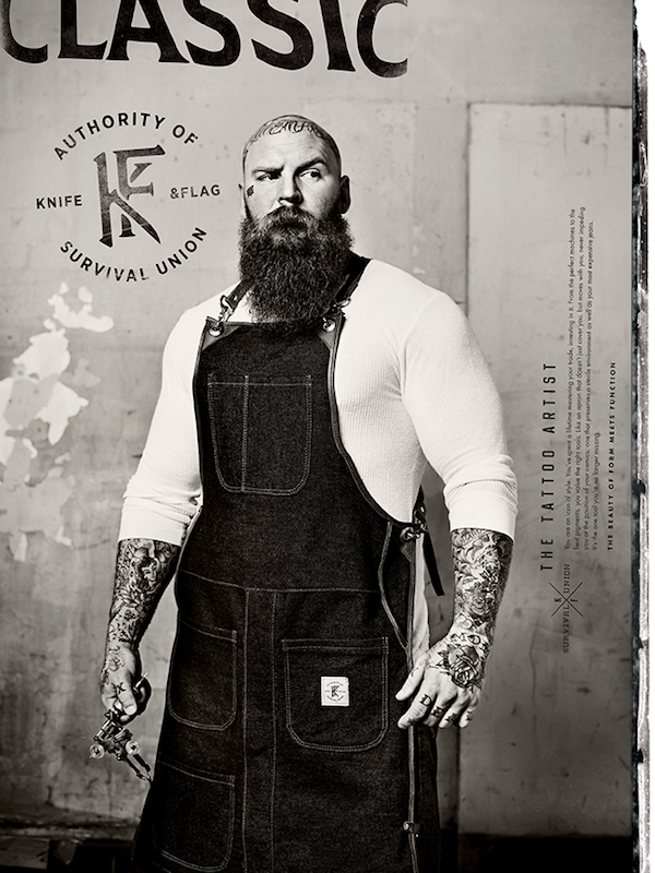 Tattoo Artist wearing Knife &amp;amp; Flag work apron.'
