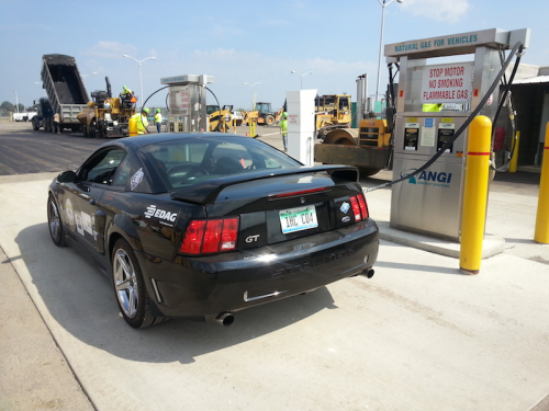 Street Legal Mustang Muscle Car refueling with CNG.'
