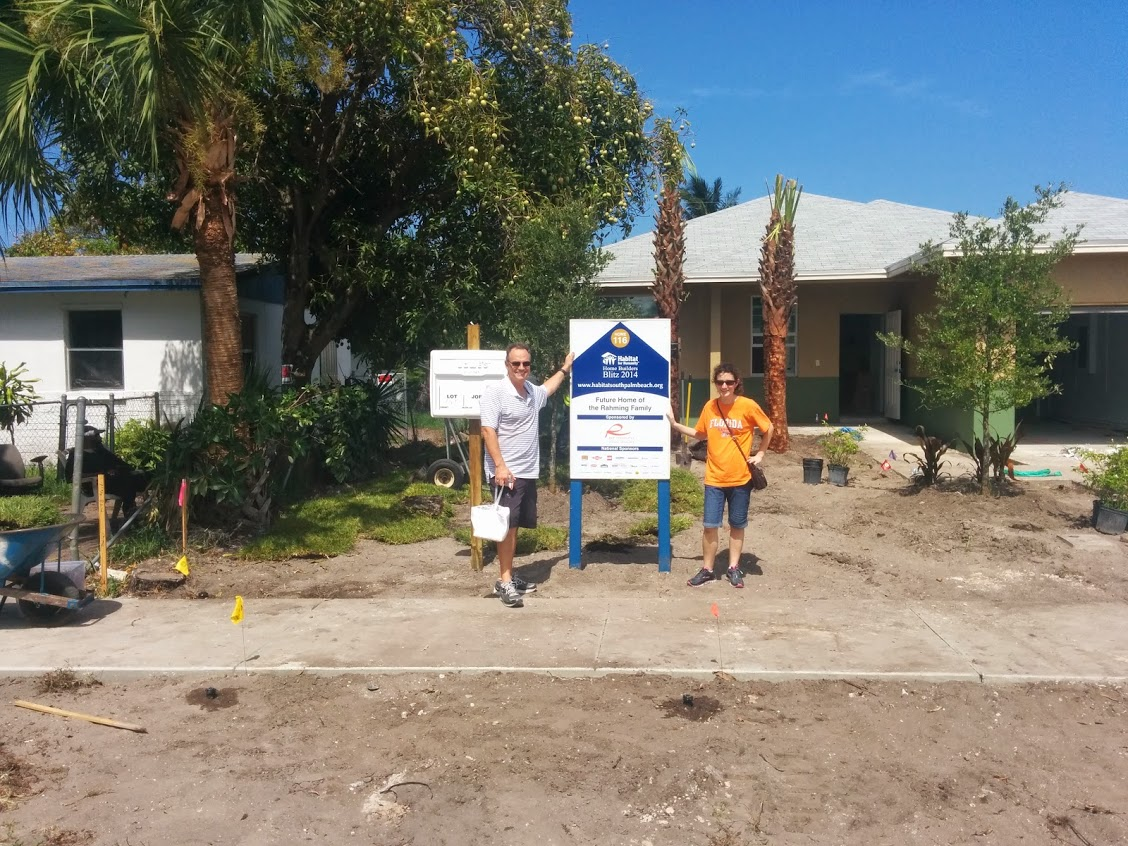 David and Mallory pose outside of unfinished house