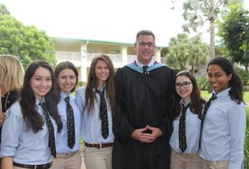 Patrick Roberts and students at Palmer Trinity School'