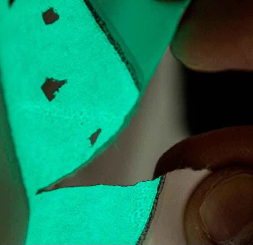 Llectroluminescent paint on paper sample for packaging'