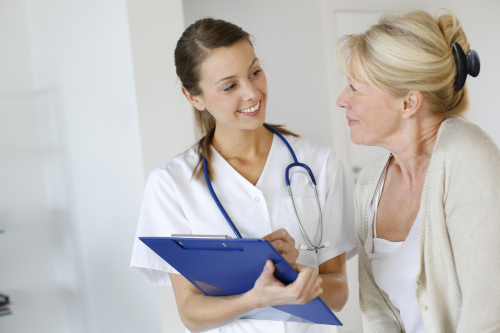 Woman Discussing Sexual Health Issues with Nurse'