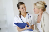 Woman Discussing Sexual Health Issues with Nurse