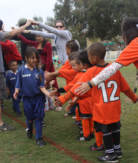 Young soccer players learn about sportsmanship