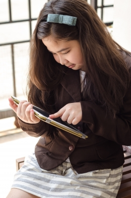 Children in schools using WiFi tablets'